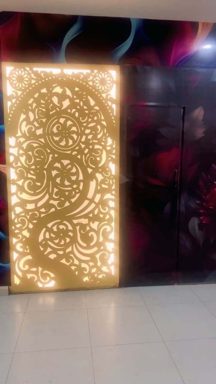 Backlit gold filigree screen at the spa entrance